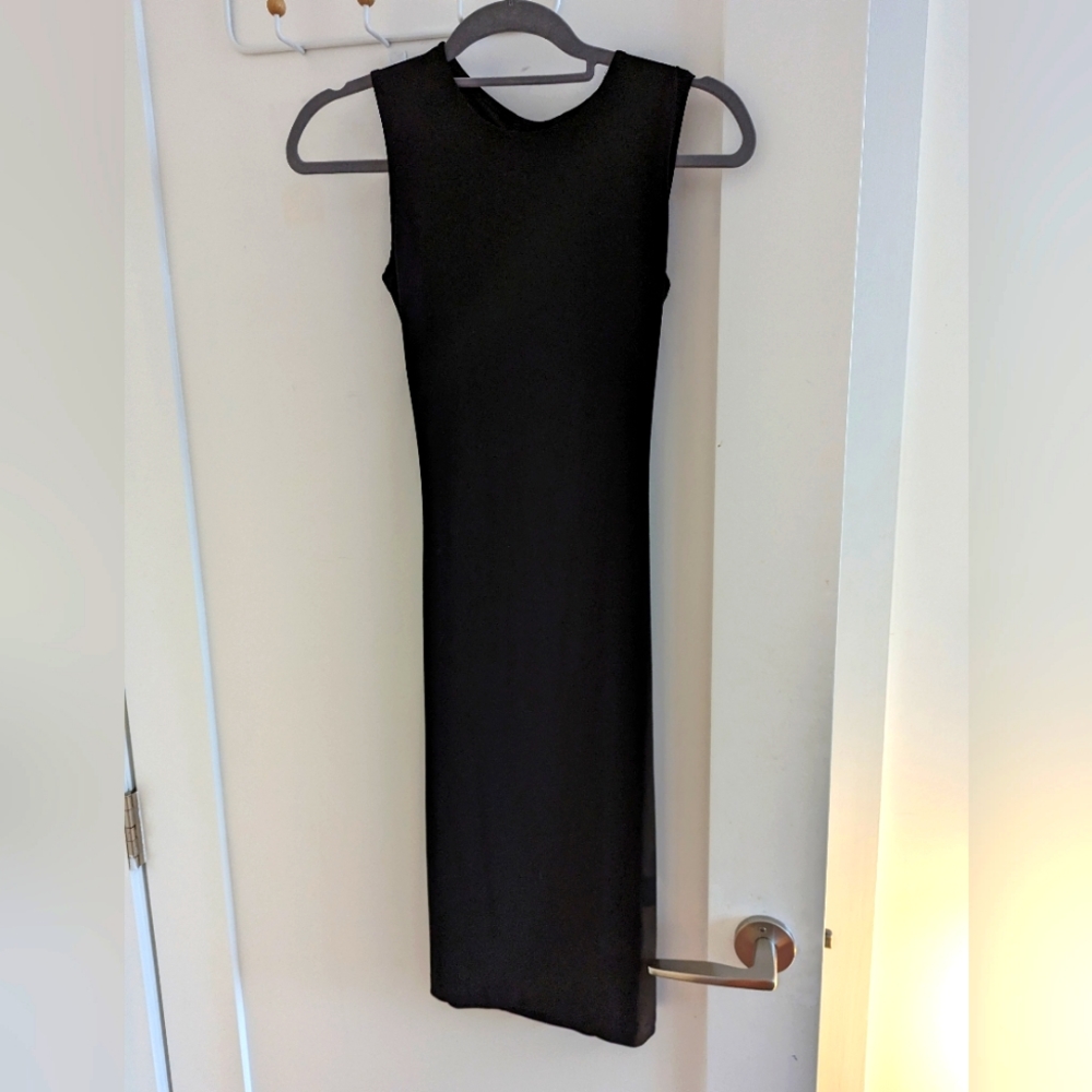 Sexy but subtle black open back knee length dress